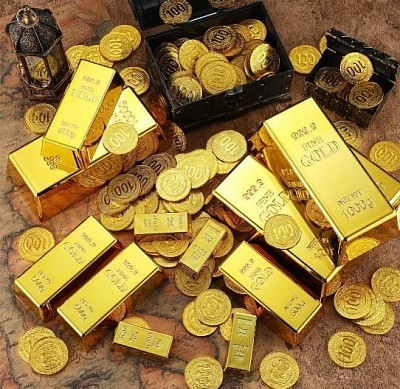 Gold bullion bars and coins arranged for international trading standards