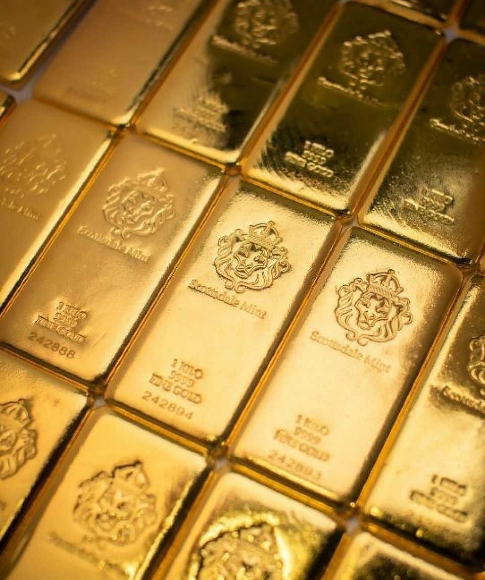 Gold bars and coins representing large-scale African gold supply